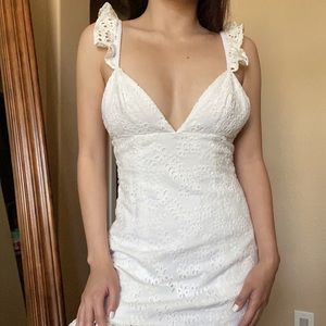 Cute floral eyelet dress with ruffle sleeves, never worn and still has tags